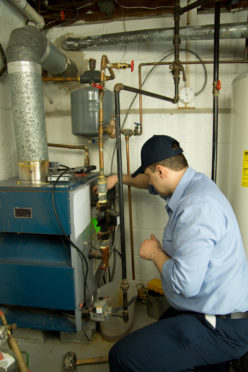 Neffsville Employee Working on a Furnace