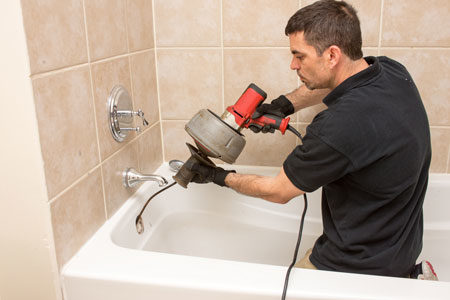 Neffsville Employee clearing out a bathtub drain