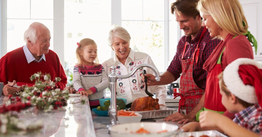 Family gathered around the kitchen counter for Christmas