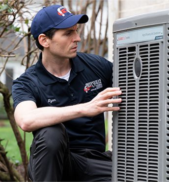 Neffsville employee working on an AC Condenser unit