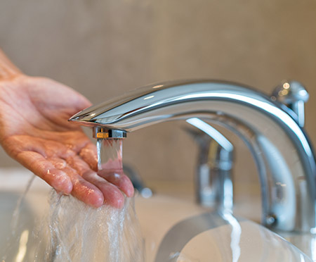 Clean water coming out of a bathroom faucet