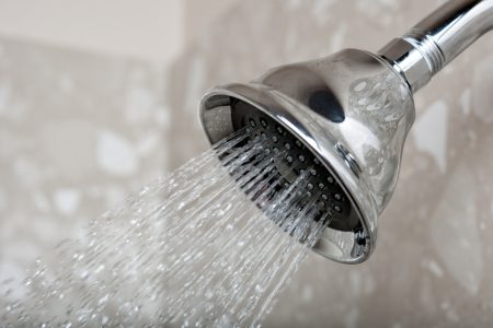 Close-up of showerhead with low water pressure.